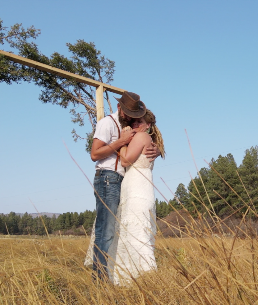 Bret James embracing his wife on their wedding day in Colorado