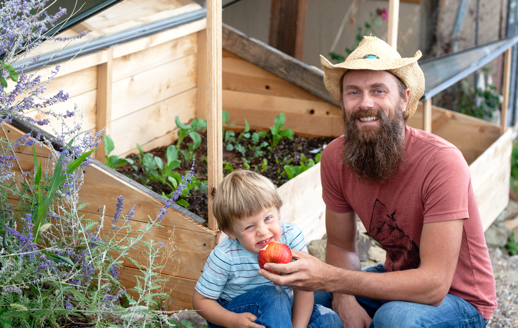 Bret James and his son together in their productive garden